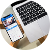 Smartphone with social media profile and open laptop on wooden desk, symbolizing digital marketing, branding, SEO, and web design services by Xefora Tech in Pune